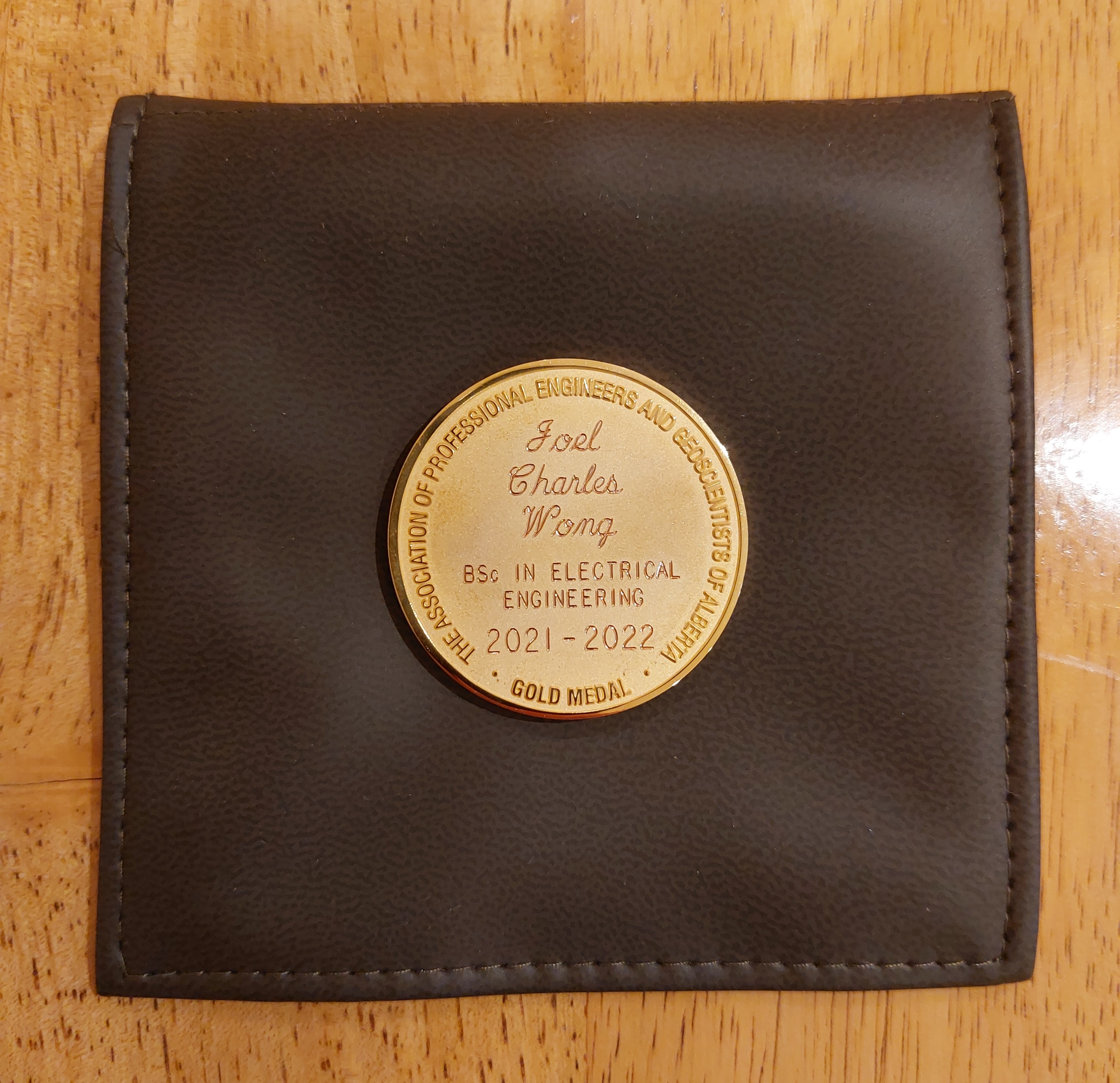 APEGA gold medal with name Joel Charles Wong enscribed